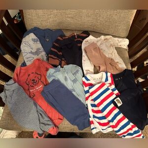 Bundle of 7 size Newborn outfits.